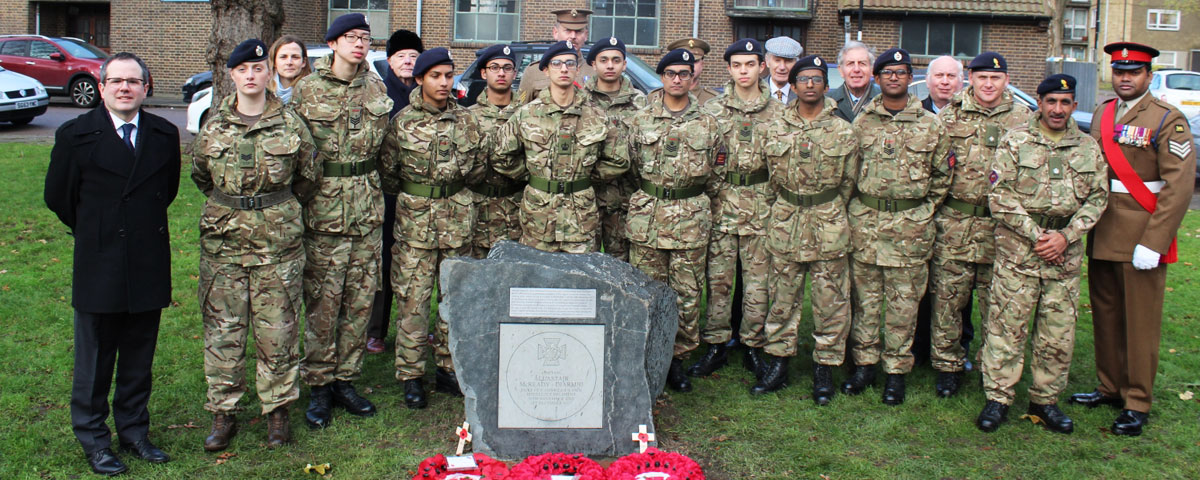 School and military representatives joining civic dignitaries to unveil a commemorative paving stone in honour of an Old Elizabethan awarded the Victoria Cross for his heroic actions on the Western Front 100 years ago